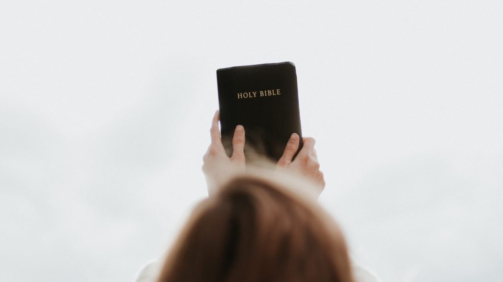 woman holding bible