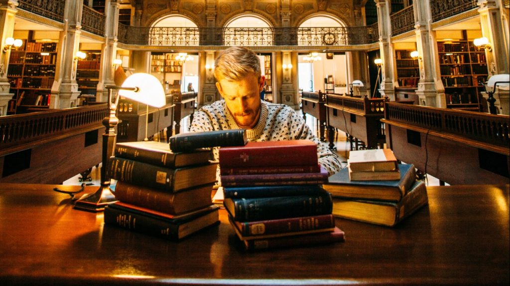 man studying in library