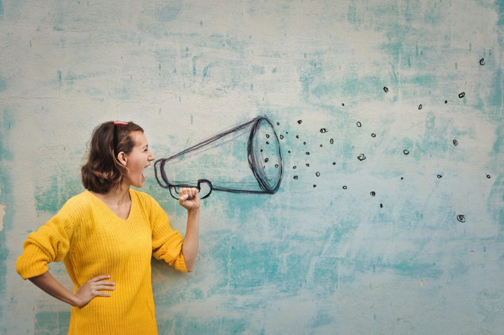 woman yelling with drawn megaphone