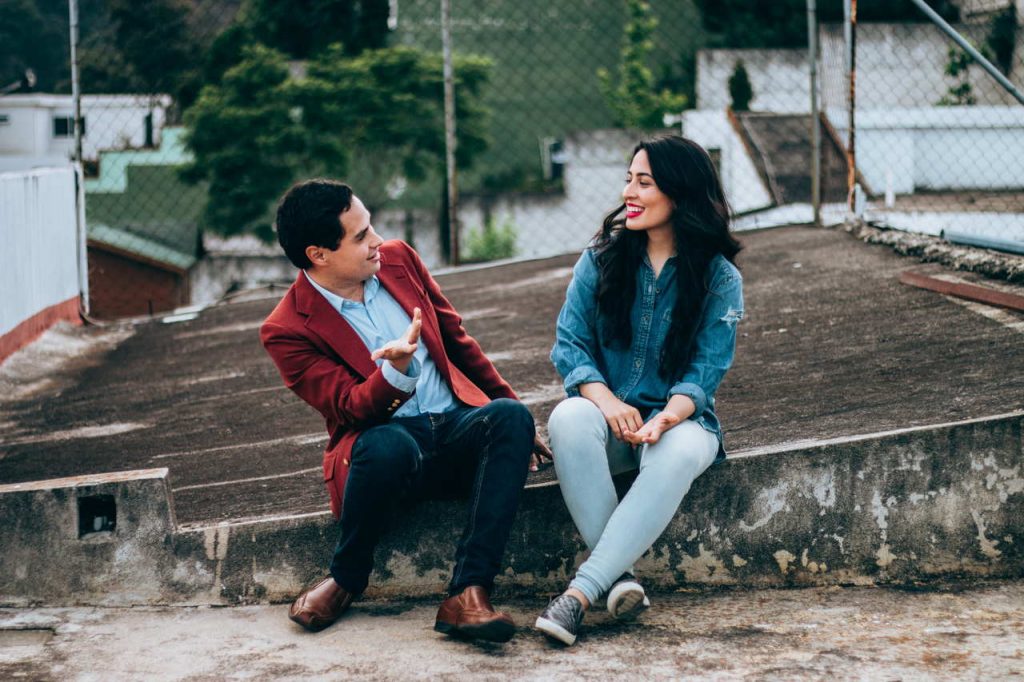 man and woman sitting next to each other