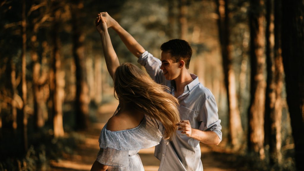 couple dancing in forest