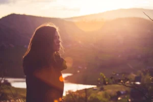 a woman at sunset, finding her way out of lesbianism