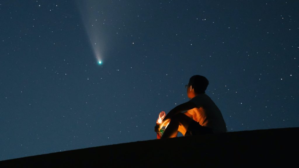 man looking at star