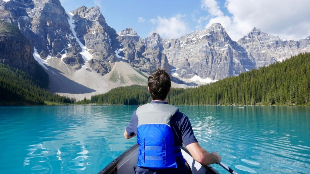 Person in canoe on mountain lake