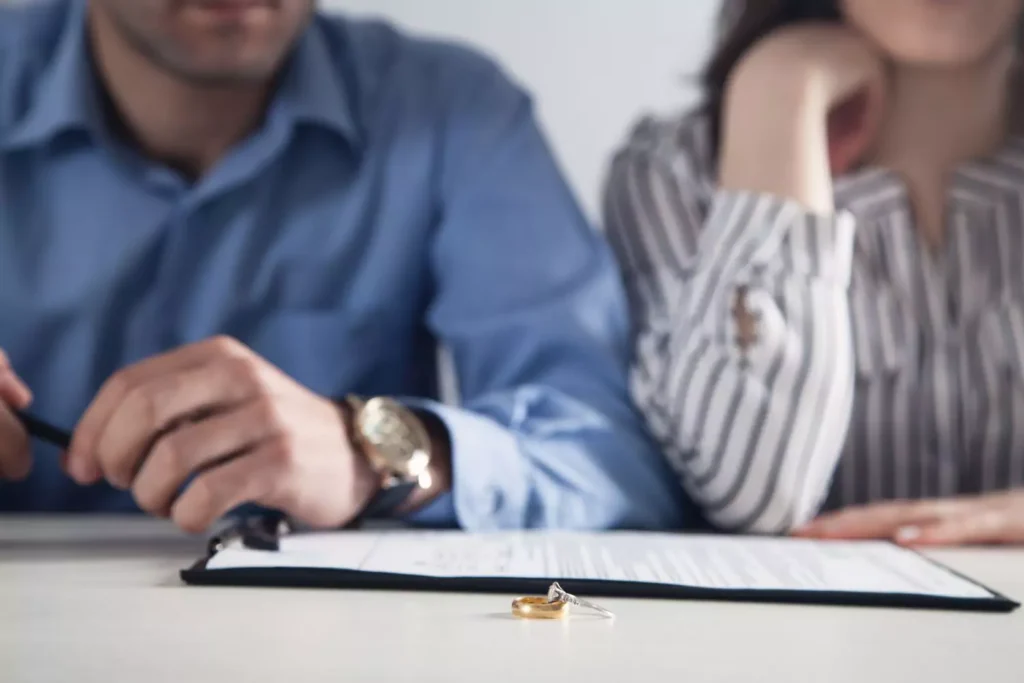 a couple with divorce papers in front of them