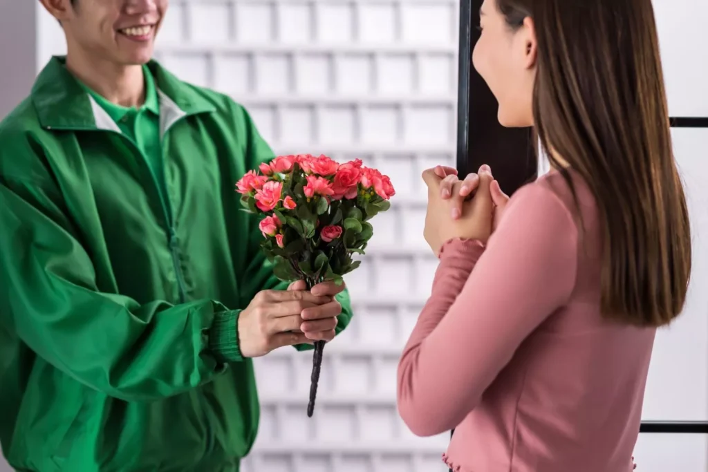 on the day of romance, a man gives a woman flowers