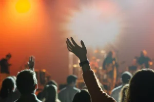 a crowd of people worshipping at church - how do you choose a church?