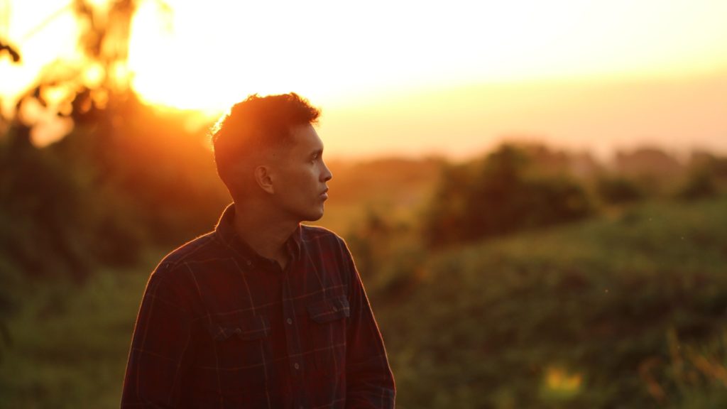 man thinking sunset