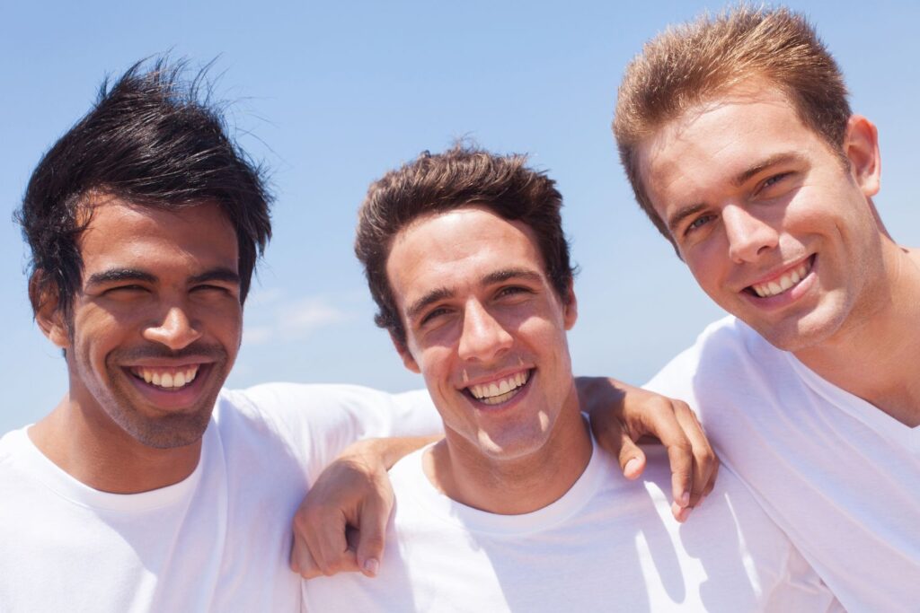 three guy friends smiling, good guys