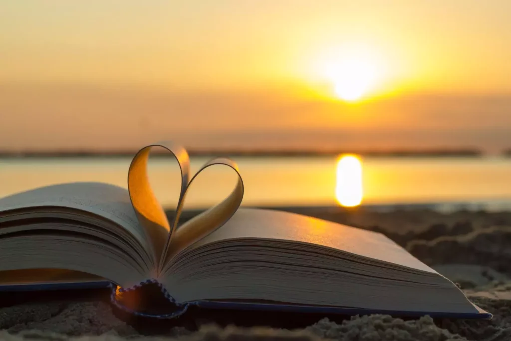 a book open, pages folded into a heart, a symbol of romance