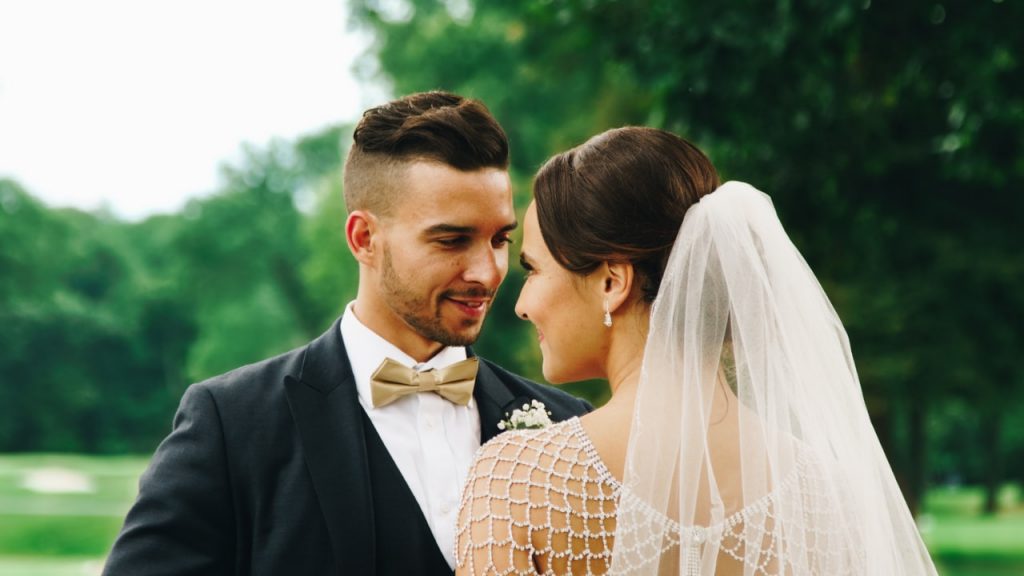 Groom looking at bride