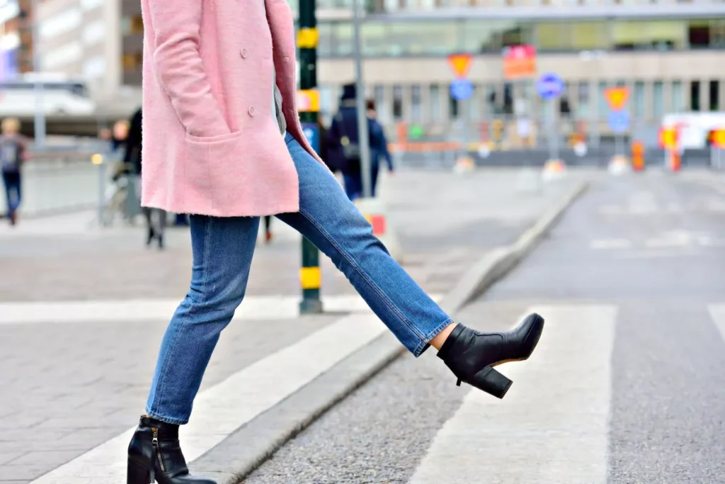 a person taking the next step into a crosswalk