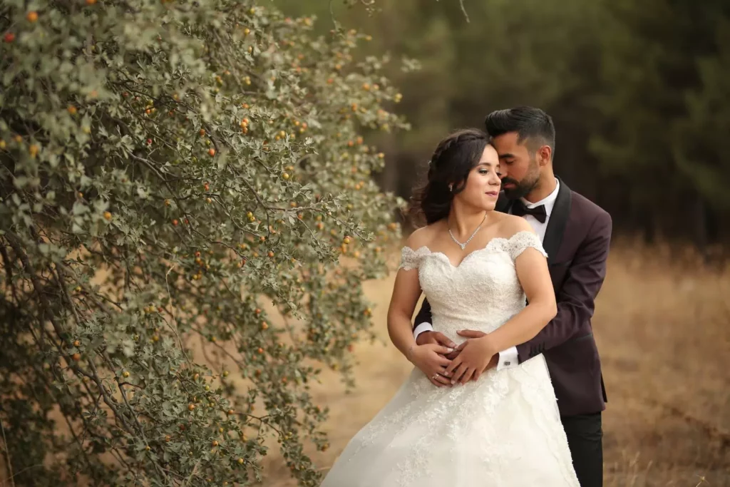 groom hugging his bride