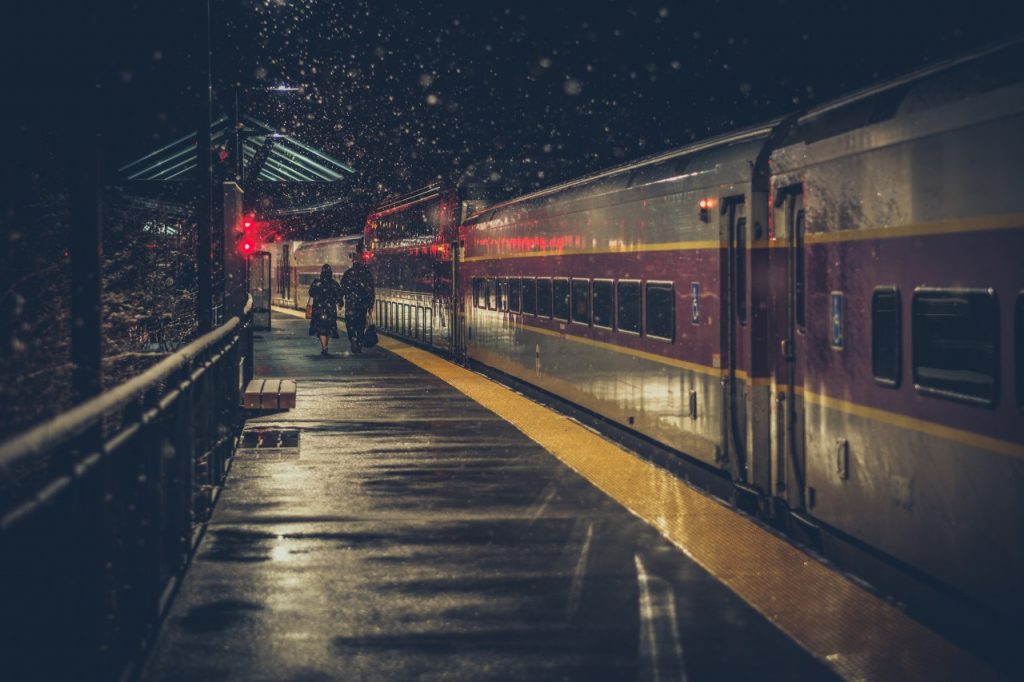 couple on a train platform at night