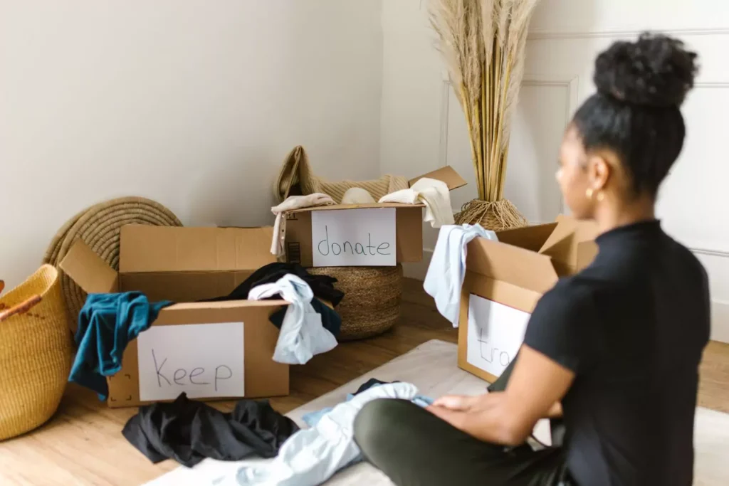 a person who has enough, donating boxes of clothing