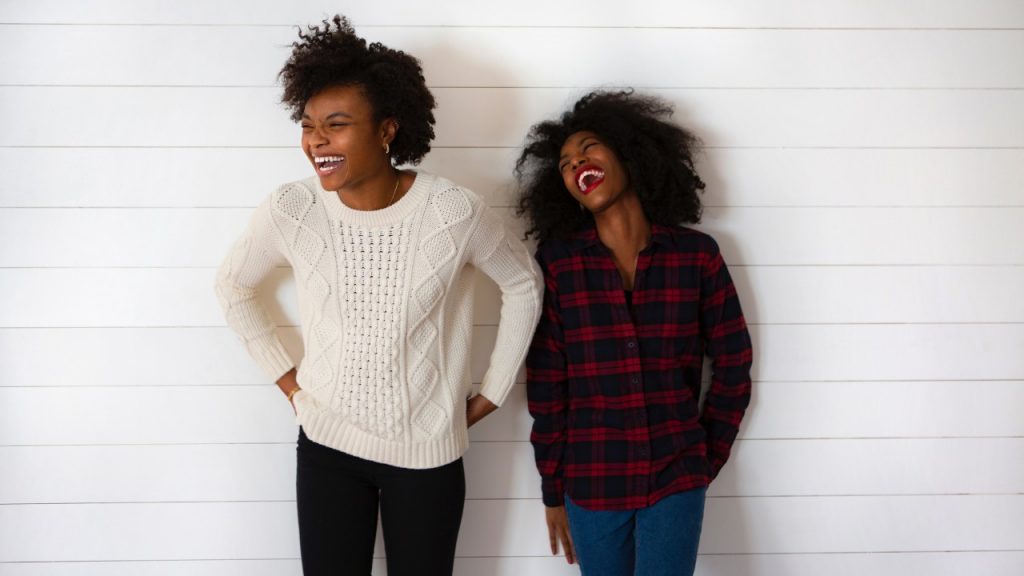 two girls laughing