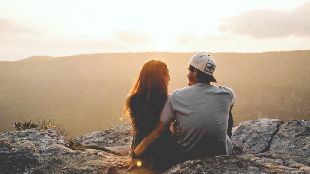 couple sitting on cliff