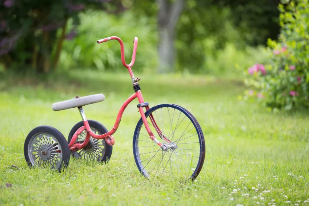 a tricycle - a symbol of being a third wheel