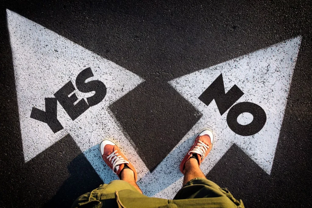 a man standing on "yes" and "no" arrows, afraid of commitment