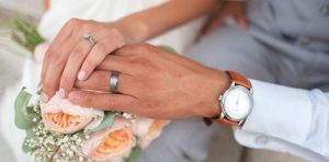 man and women hands touching wedding