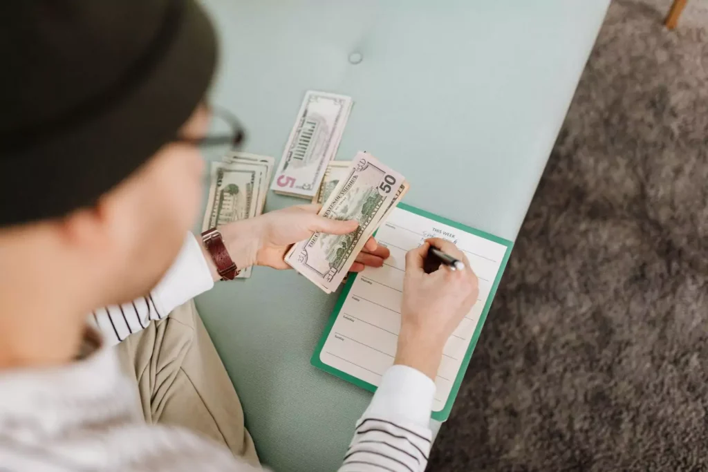 a man working on his budget, figuring out where to put his money
