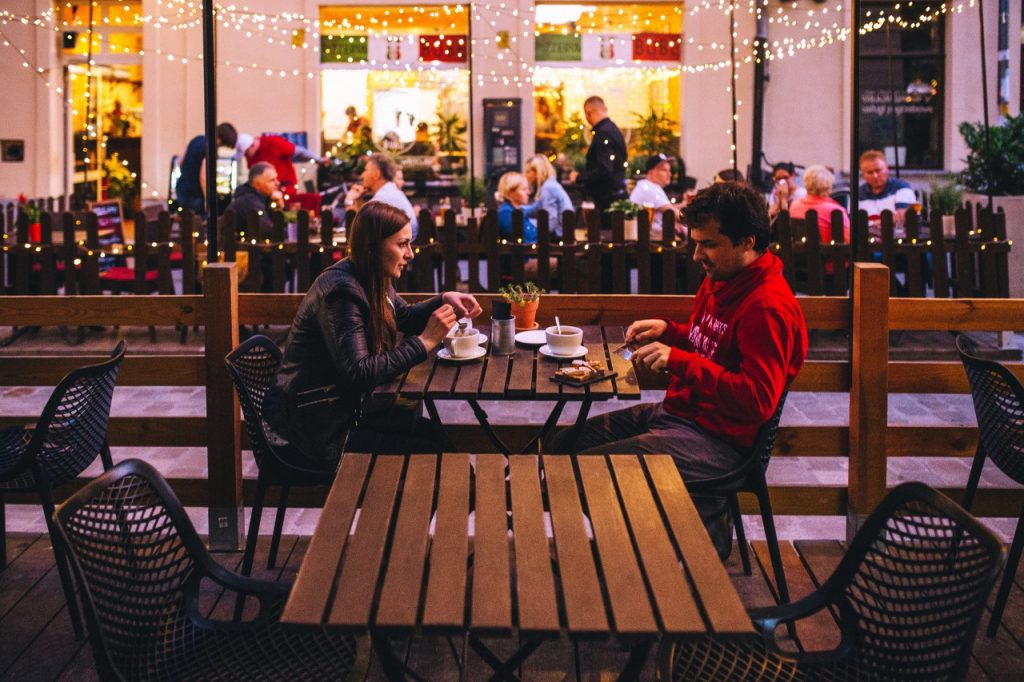 Man and woman sitting in outside eating area