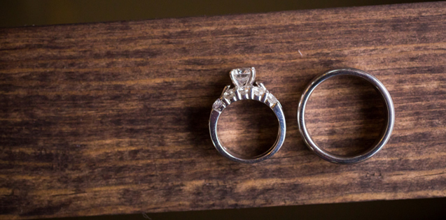 wedding rings on wooden table