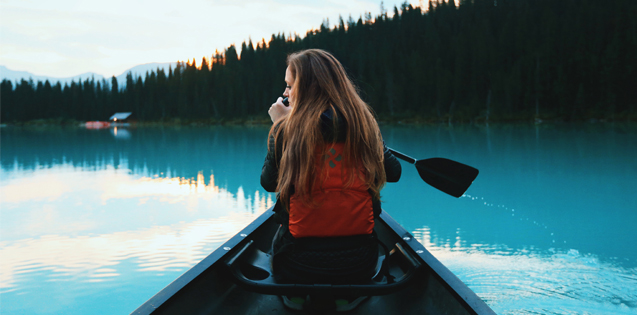 Woman alone in a canoe
