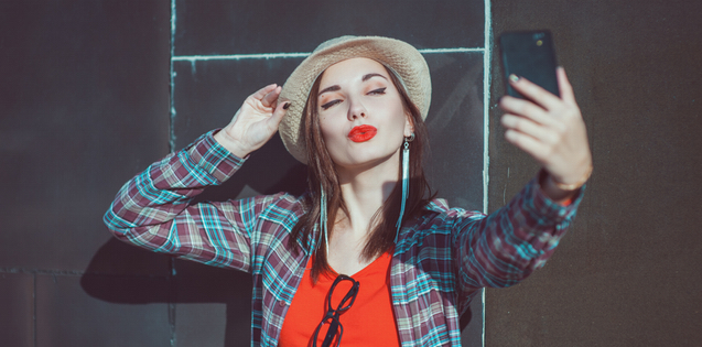 young adult woman taking a selfie