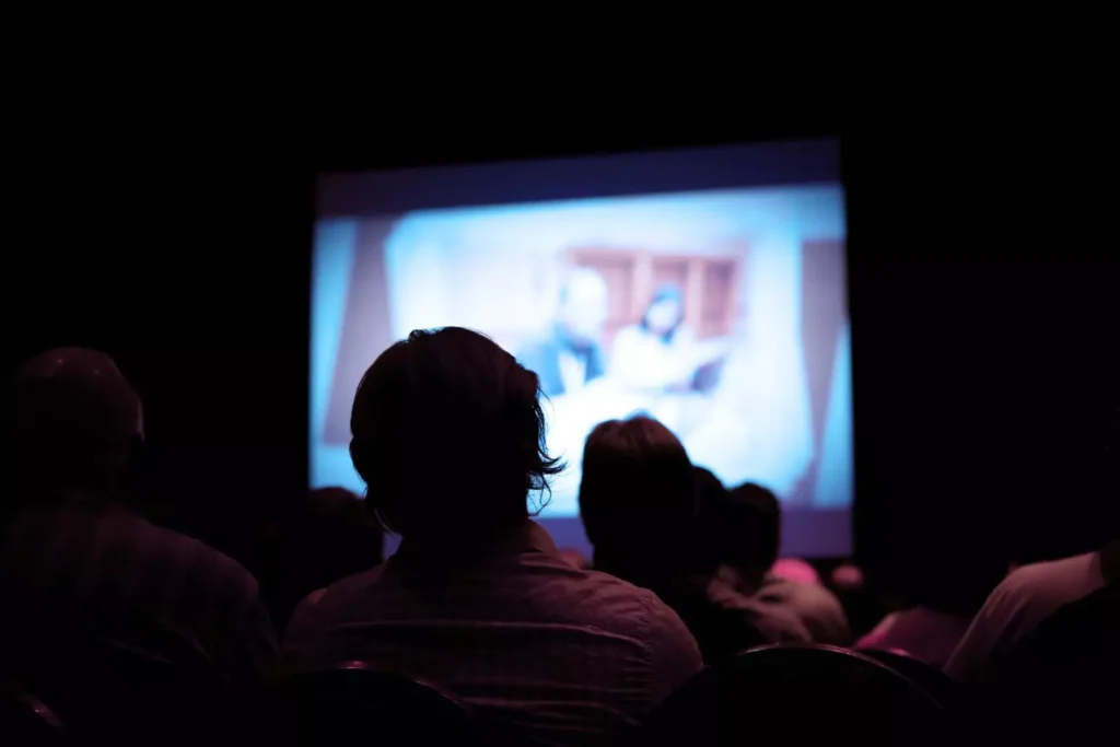 a man watching a movie thinking, at least it's not porn