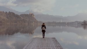 woman standing by lake