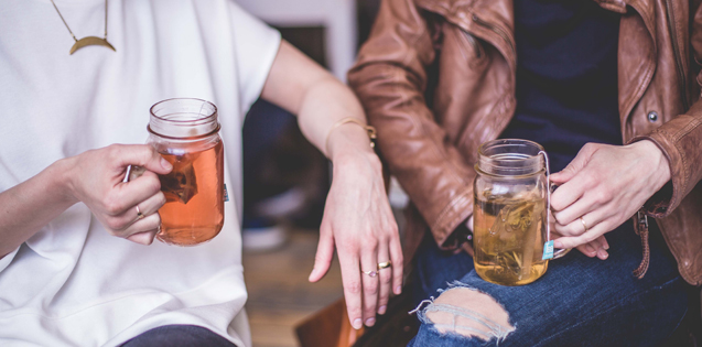 Two girls drinking tea