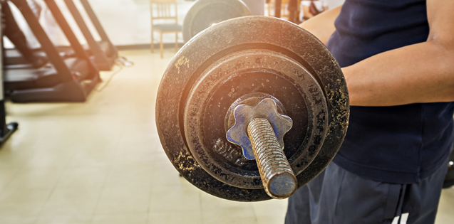 Man lifting weights in the gym