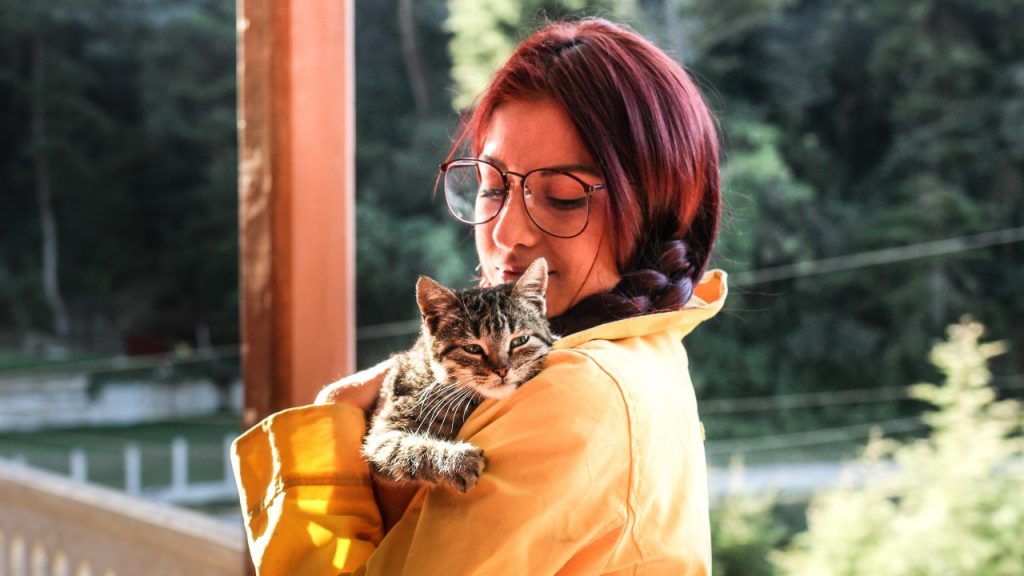 woman holding cat