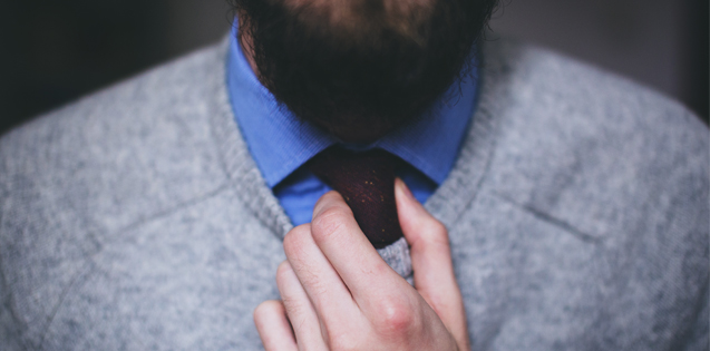 man in a sweater and tie
