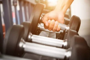 a man lifting weights, ignoring criticism
