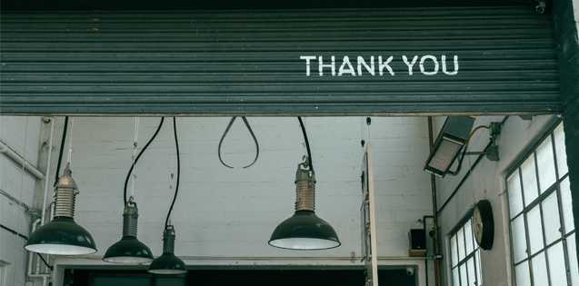 A green door with the words "Thank you"