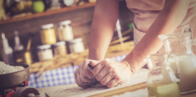 Woman baking in a rustic kitchen