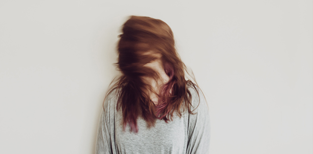 A woman flipping her hair around