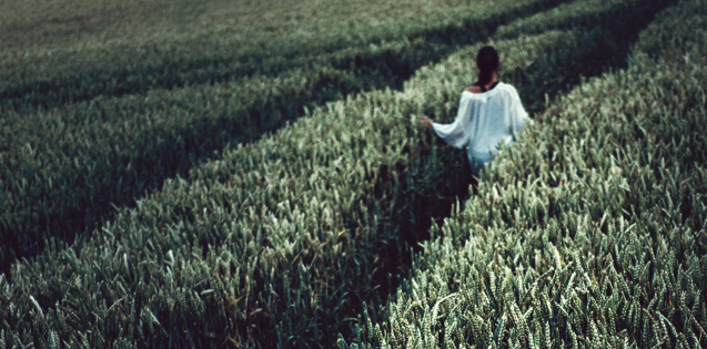 A woman walking in a field