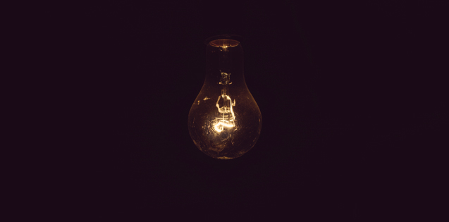 A single light bulb in a dark room