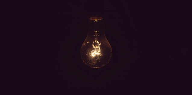A single light bulb in a dark room
