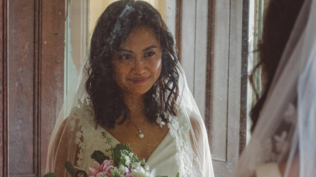 bride looking in mirror