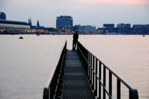 a man standing on a pier fighting for purity