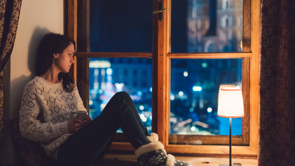 Depressed woman at home during Christmas