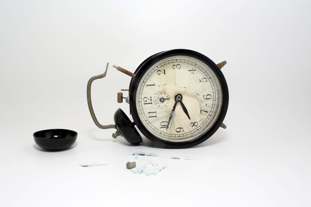 broken clock with isolated white background
