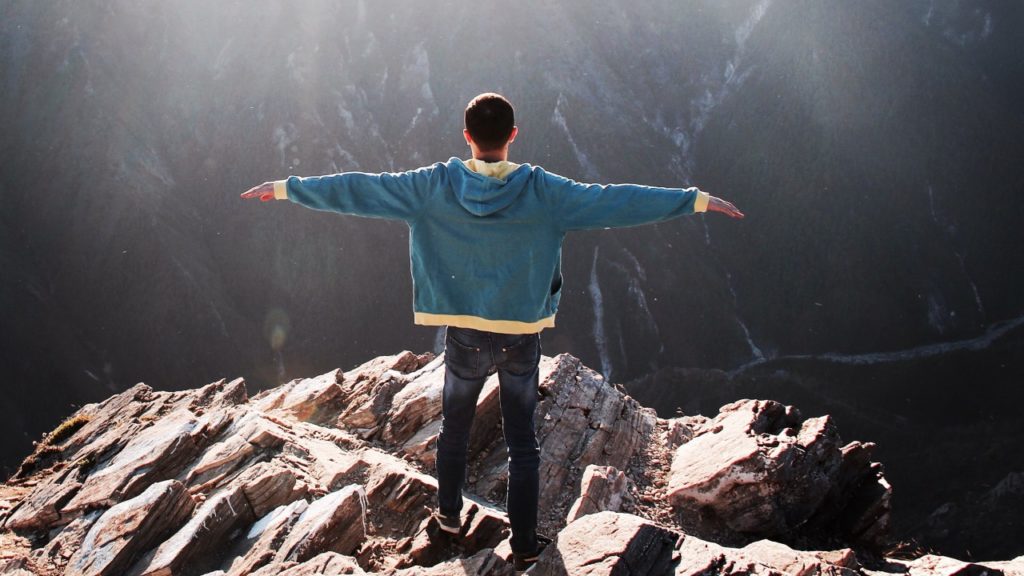 man standing on a mountain