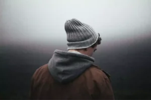 a man waiting in the fog