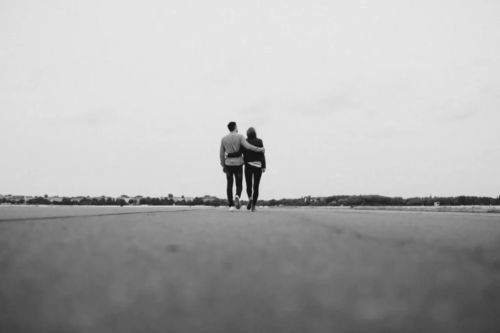 a couple walking in the same direction