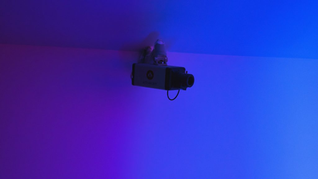 security camera with electric-blue background